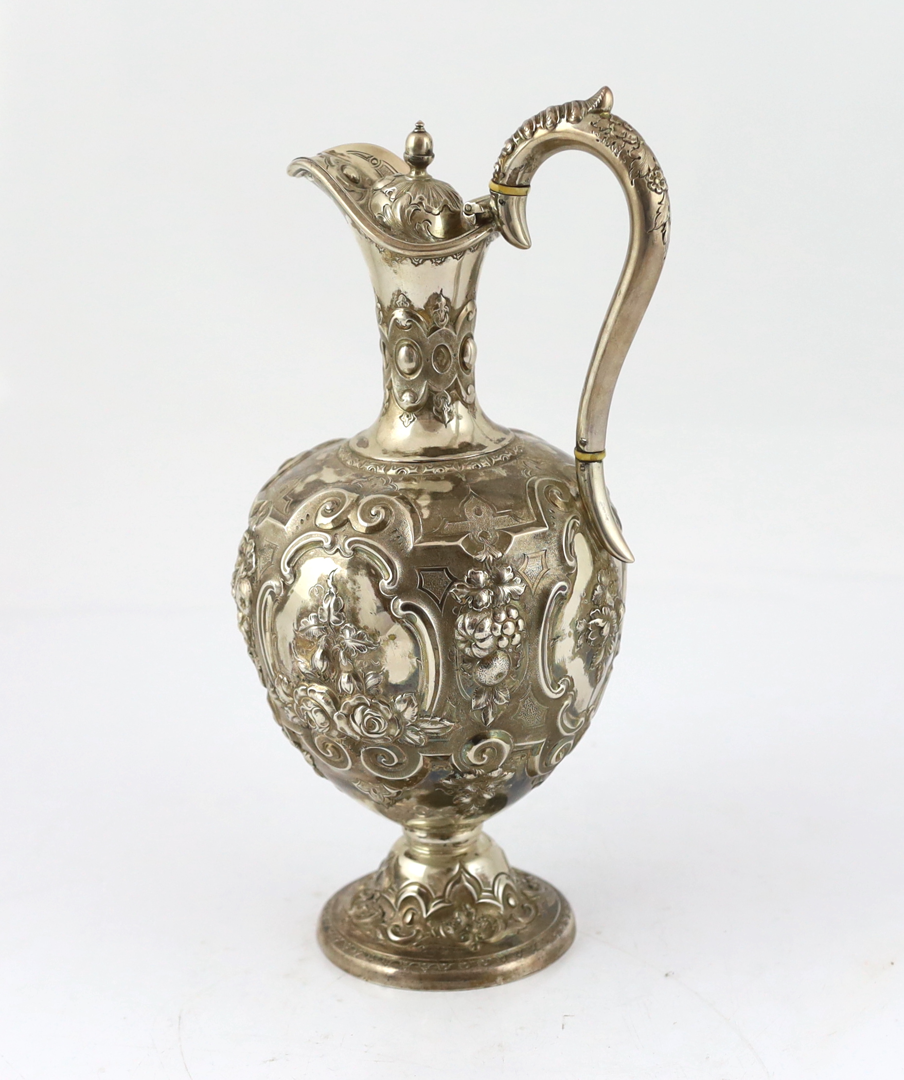 A Victorian embossed silver pyriform hot water ewer, by Martin, Hall & Co, CITES Submission reference V7KAR72D